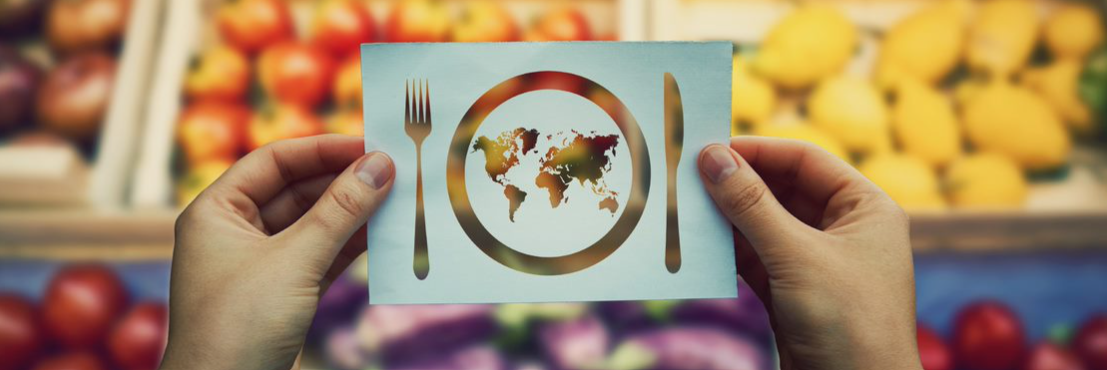 Global cuisine concept with world map on plate.