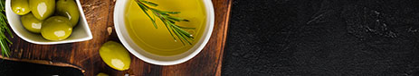 Olive oil and olives in bowls